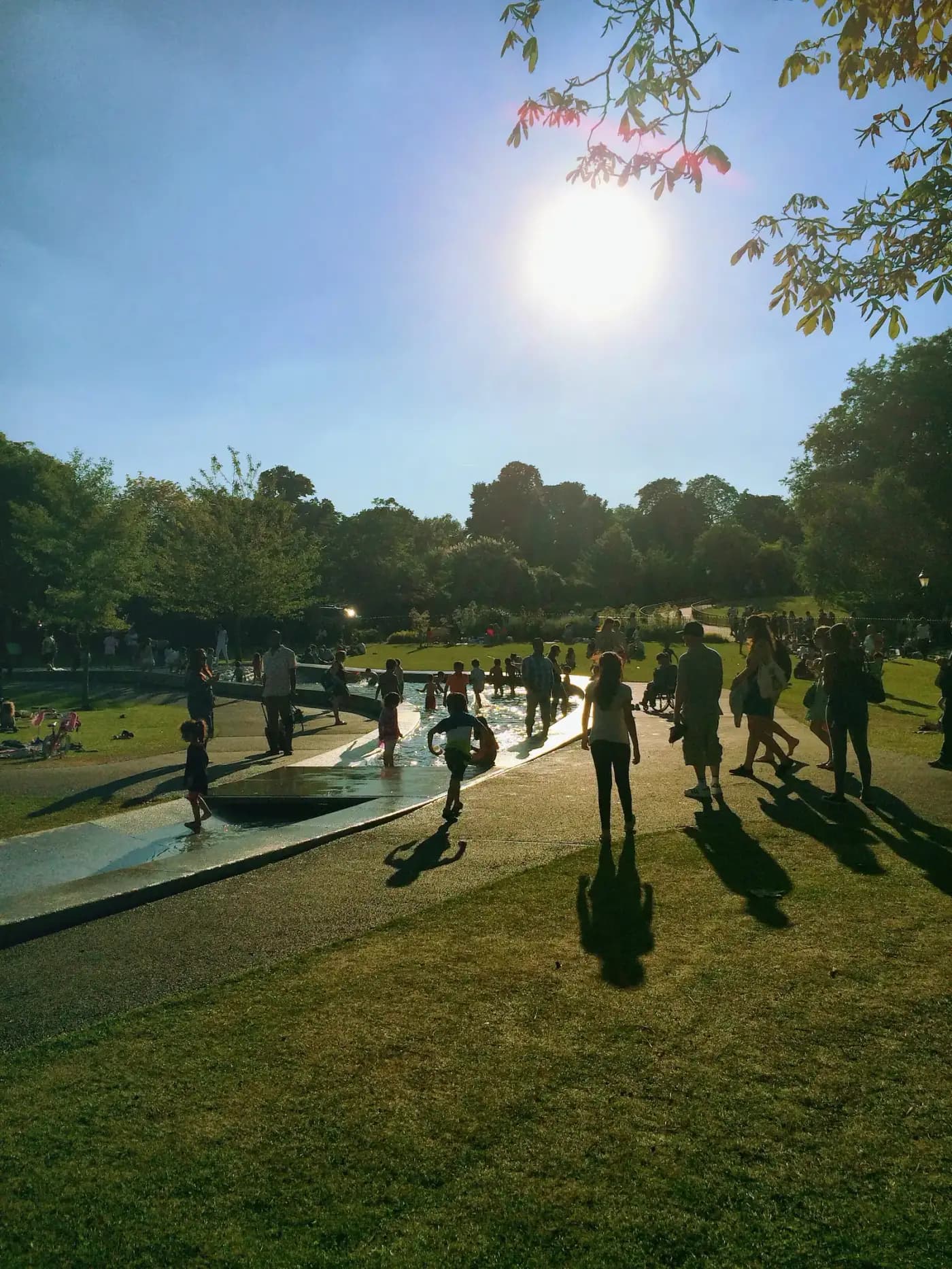 Families enjoying a sunny afternoon at a community park